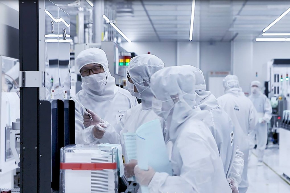 Workers are seen inside a cleanroom at chip maker Ningbo Semiconductor International Corp in eastern Zhejiang province. Photo: Handout