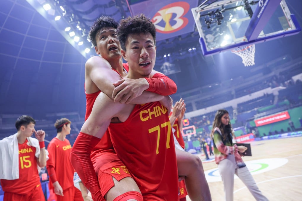Zhang Zhenlin of China carries his teammate Zhao Rui after the 17-32 win against Angola at the 2023 FIBA World Cup in Manila. Photo: Xinhua