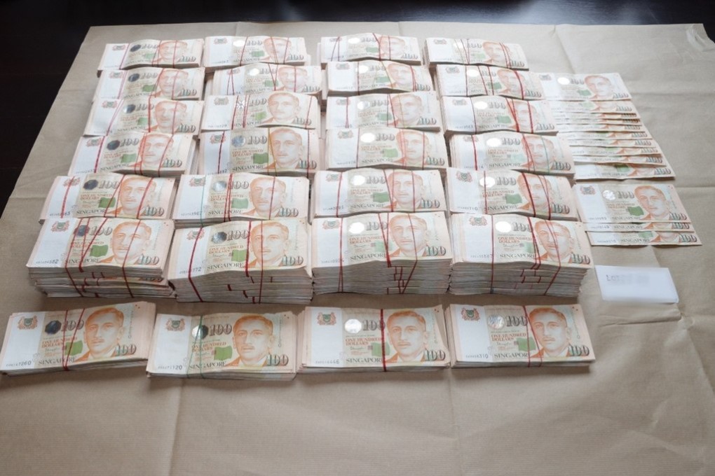 The Singapore Police Force has seized or frozen about 1 billion Singapore Dollars worth of assets including cash, properties, vehicles, luxury goods and gold bars, in one of Singapore’s largest anti-money laundering operations. Photo: EPA-EFE/Singapore Police/Handout