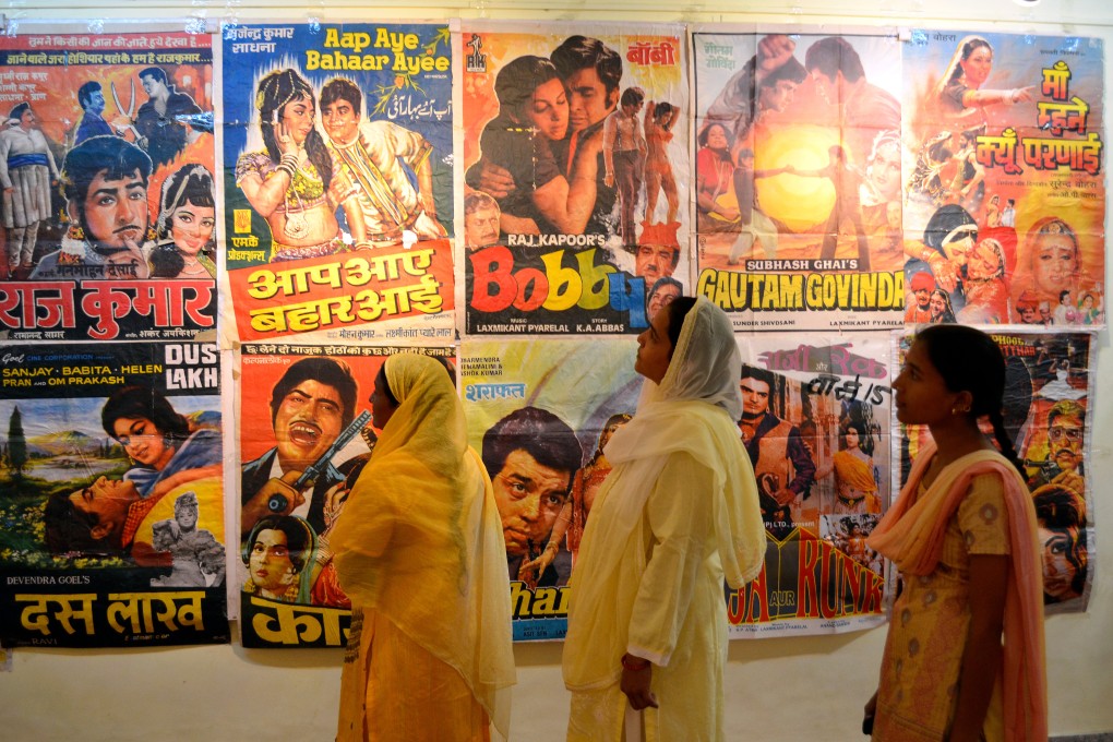 Women film fans eye movie posters at an Indian cinema. Women who work in the Indian film industry, on and off set, are outnumbered and lack representation from male-dominated trade unions. There are signs they have had enough. Photo: Shutterstock