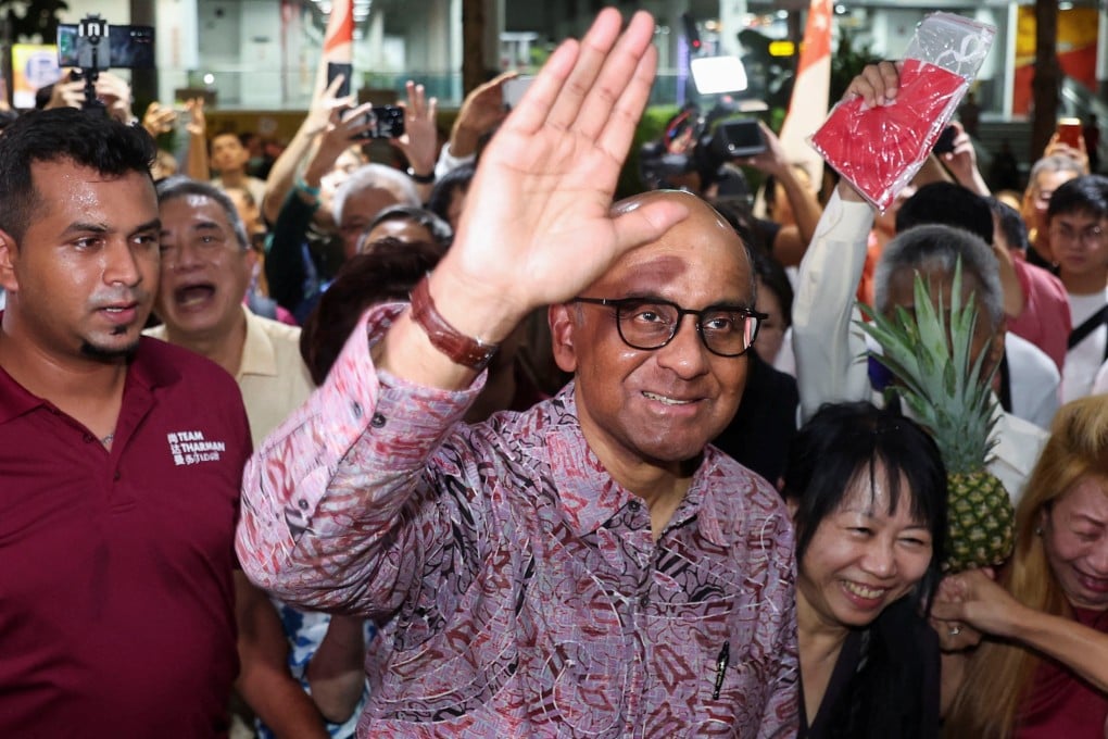Tharman Shanmugaratnam waves to supporters in Jurong. Photo: Reuters