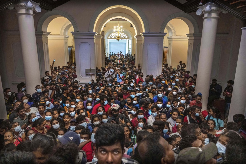 People gathered inside President Gotabaya Rajapaksa’s official residence in Colombo last year. Photo: AFP