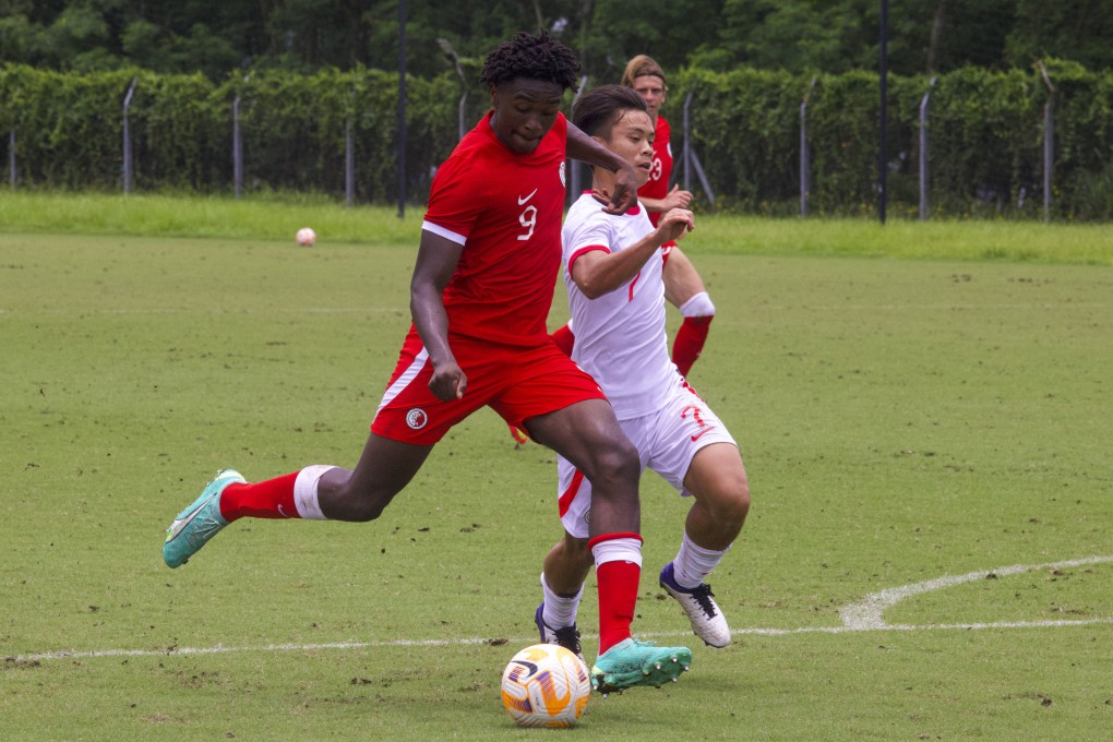 Hong Kong football officials are desperate to get a passport for Michael Udebuluzor (left) so that he is eligible to represent the city. Photo: Jonathan Wong