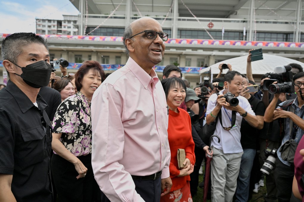 Presidential candidate Tharman Shanmugaratnam and his wife, Jane Yumiko Ittogi (in red). Photo: Reuters