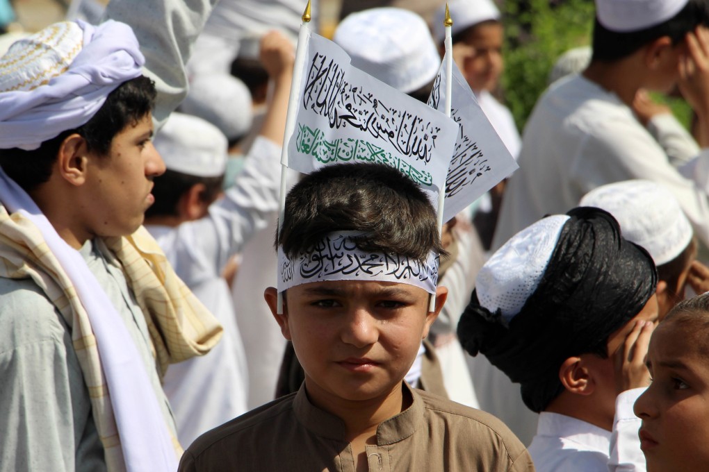 Afghan boys gather to mark the second anniversary of the US withdrawal, in Kandahar, Afghanistan, on August 31. With its extreme interpretation of Islam, the Taliban is seeking to turn Afghanistan into an ideological state. Photo: EPA-EFE