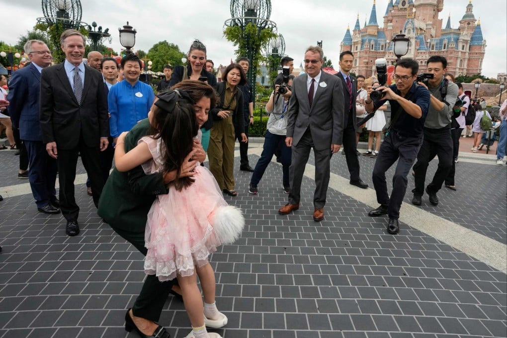 US Commerce Secretary Gina Raimondo embraced a girl wearing a costume at the Shanghai Disney Resort on August 30, 2023. Photo: AFP