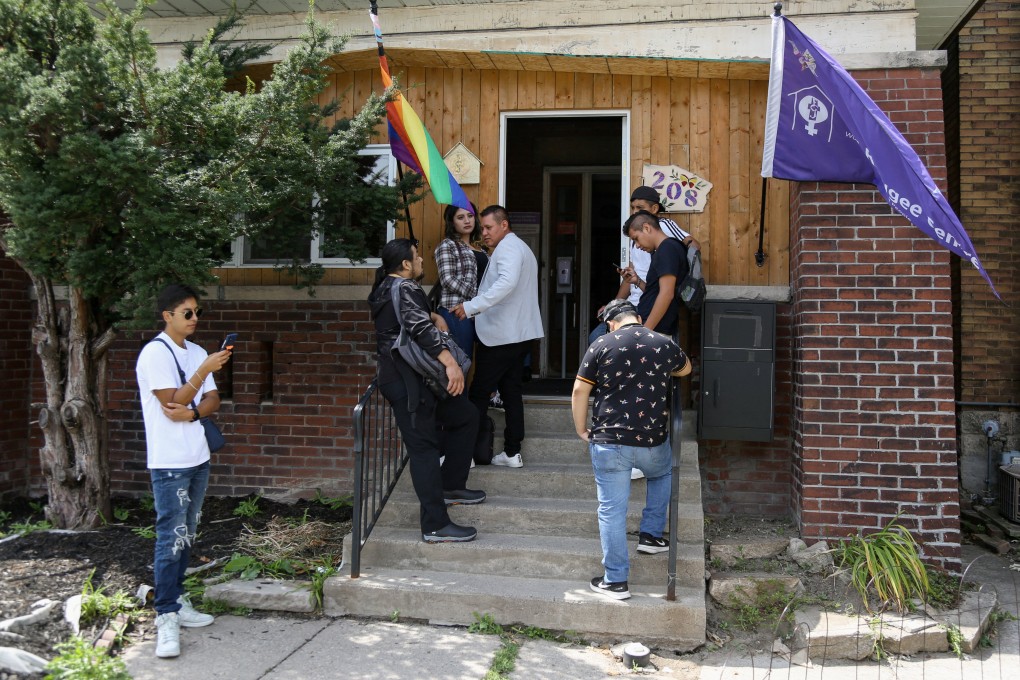 People wait to seek help from the FCJ Refugee Centre, which provides essential assistance for refugee claimants in Toronto, Canada. Photo: Reuters