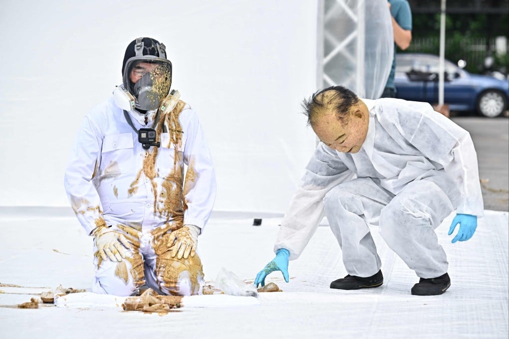 Thai architect Duangrit Bunnag has bags of cow faeces thrown at him in response to Pheu Thai Party’s inclusion of army-linked parties in the government coalition. Photo: AFP