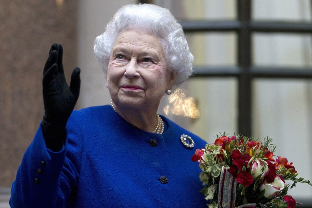 Britain’s Queen Elizabeth waves to members of staff of The Foreign and Commonwealth Office as she ends an official visit as part of her Jubilee celebrations in London in December 2012. Photo: AP
