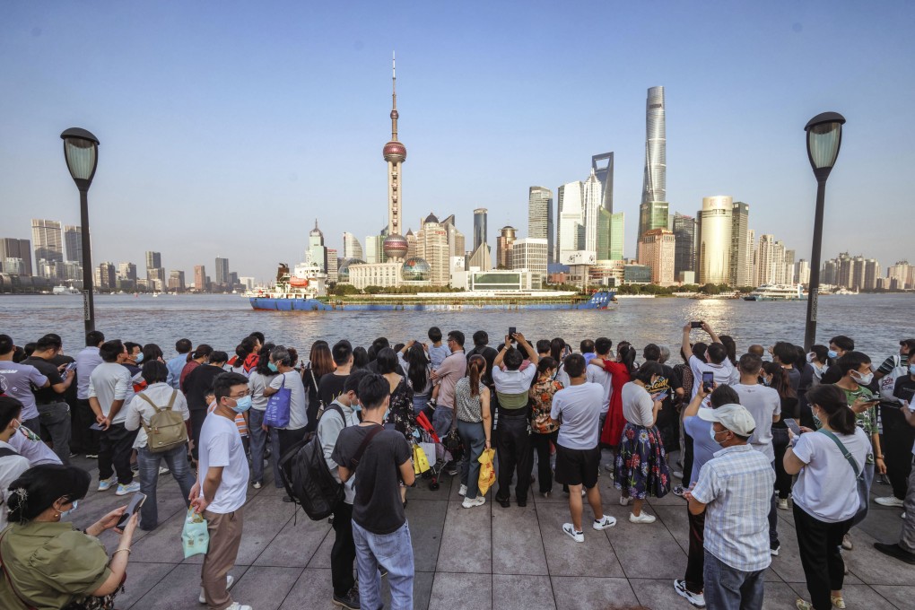 People seen on the Bund as they mark China’s National Day in Shanghai on October 1 last year. Photo: EPA-EFE