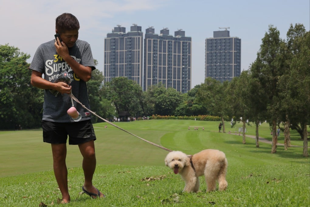 Dogwalkers were among the first visitors to a public park located on a section of a golf course taken back by authorities. Photo: Jelly Tse