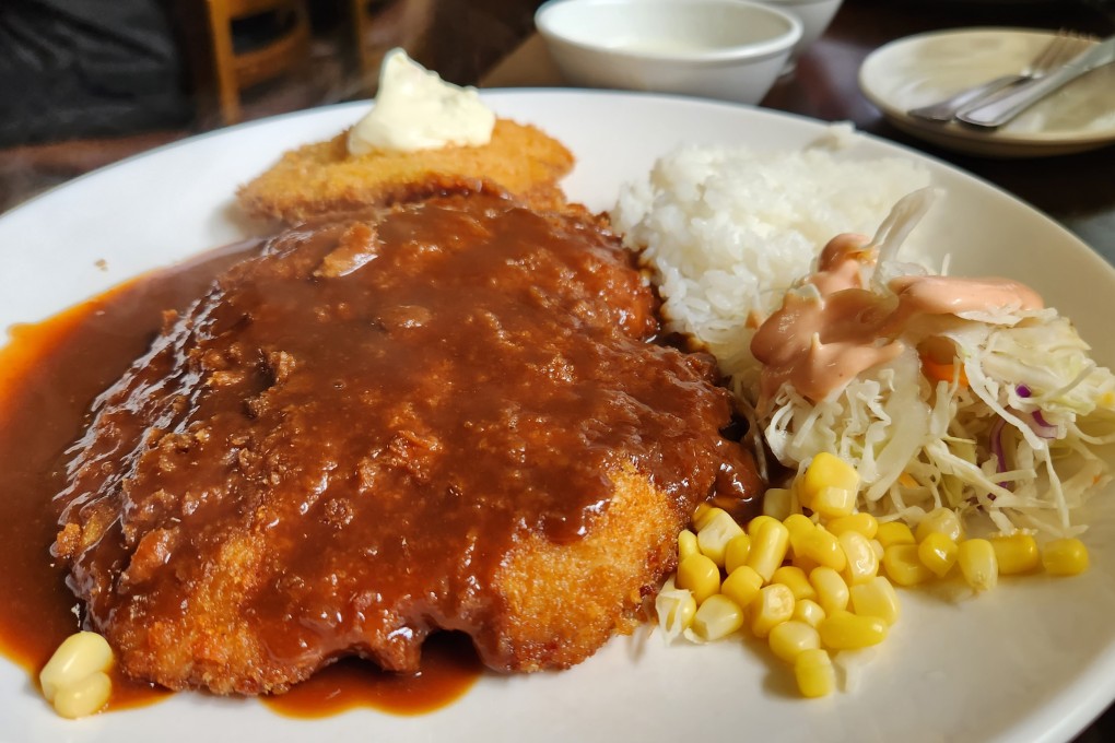 Tonkatsu served with white rice, cabbage salad, cream soup, kimchi and peppers, at a restaurant on Mount Nam, Seoul. The Japanese dish features in Disney+‘s new K-drama Moving, but how did it become so well-loved in the South Korean capital? Photo: Naver