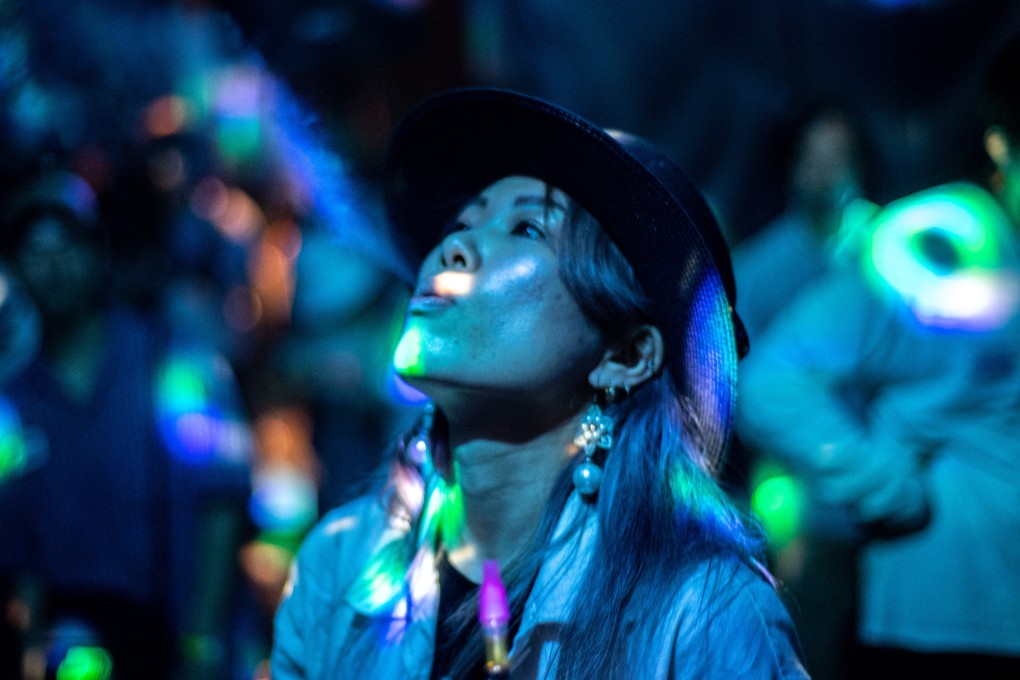 A woman uses a cannabidiol (CBD) vape at a “Cannabis Open” event in Tokyo last summer. Japan’s health ministry said the harmful substance detected in the new additions to its “dangerous drugs” list was a modified form of tetrahydrocannabinol (THC) – a different, and psychoactive, cannabis extract. Photo: AFP