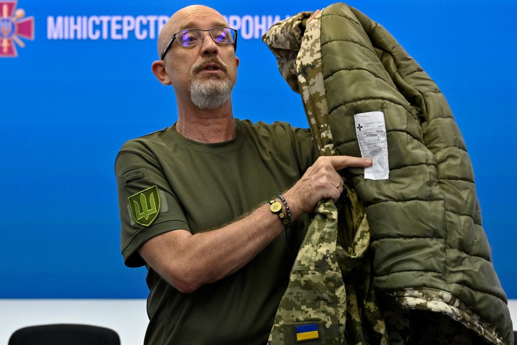 Ukraine’s Minister of Defence Oleksii Reznikov showing military uniforms during a press conference in August. Photo: AFP