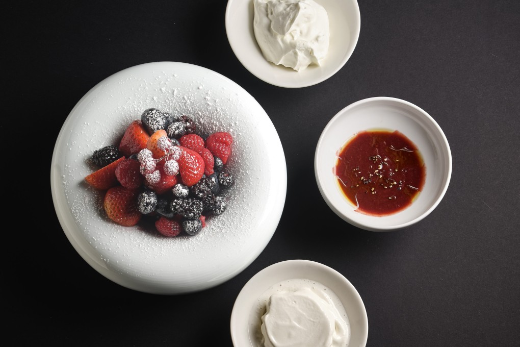 Keto diet: ‘only’ 1,088 calories for a fine dining meal? It’s possible, according to Hong Kong chef Olivier Elzer.  Above: fresh berries with whipped cream, olive oil coulis and Normandie milk ice cream from Clarence in Soho, Hong Kong. Photo: Clarence
