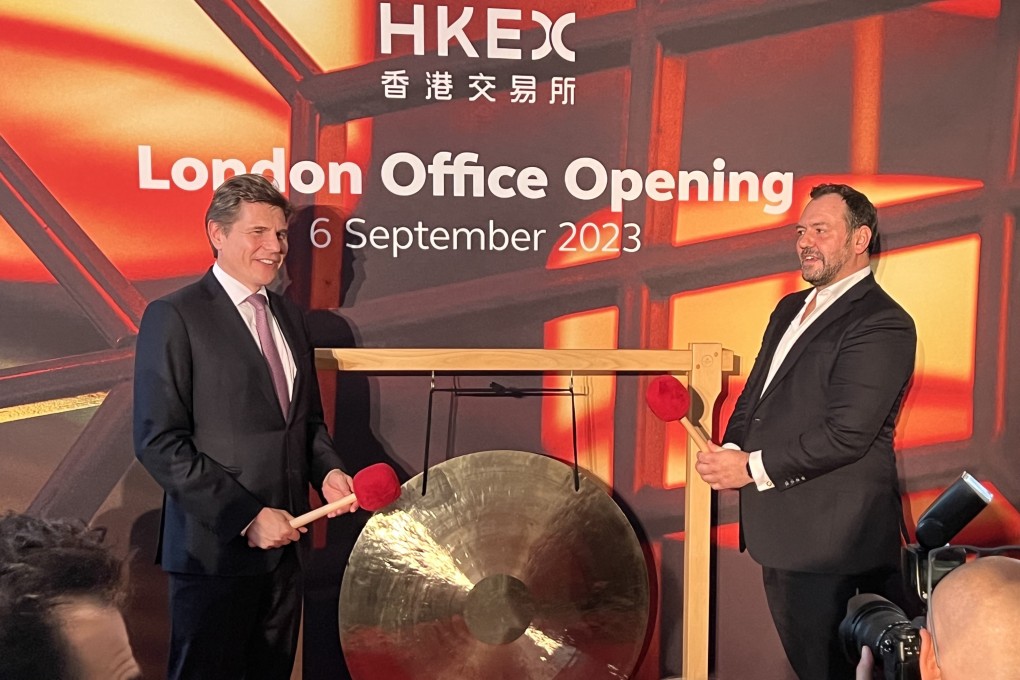 Nicolas Aguzin, Hong Exchanges and Clearing (HKEX) CEO, left, and Kevin Rideout, HKEX’s co-head of sales and marketing, ring a ceremonial gong to celebrate the opening of the bourse operator’s new office in London on September 6, 2023. Photo: Chad Bray