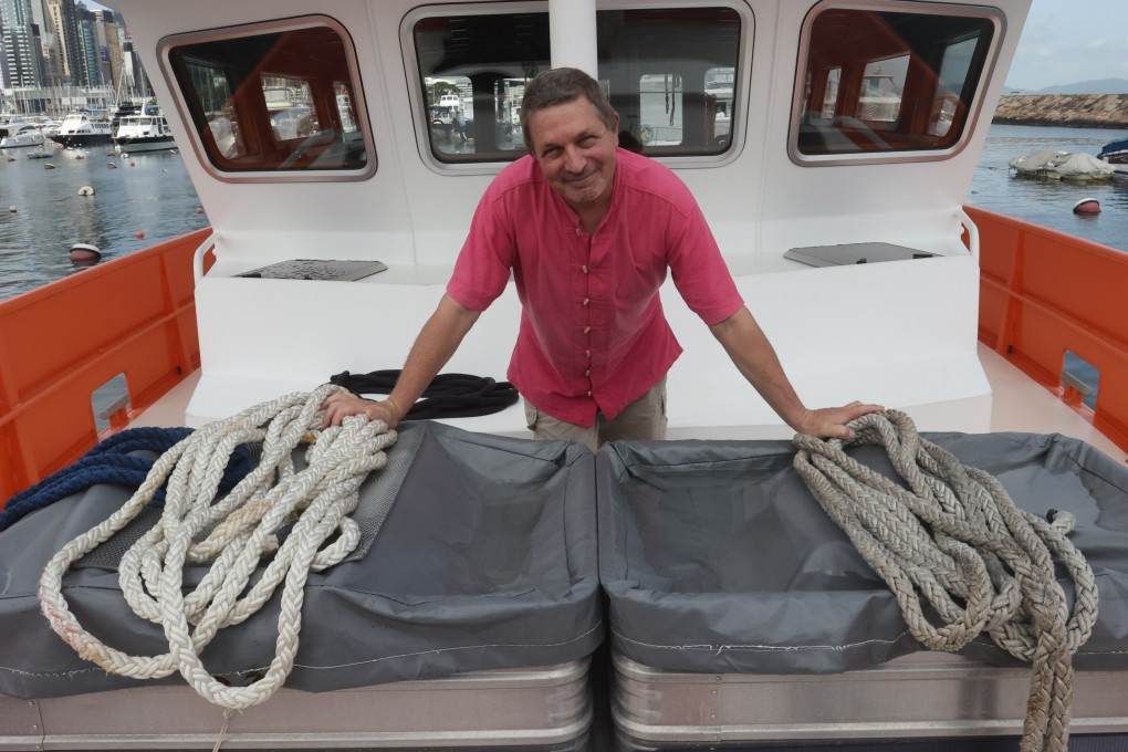 Pierre Sauvadet on his boat moored at Causeway Bay Typhoon Shelter. 
31JUL23 SCMP / Jonathan Wong

