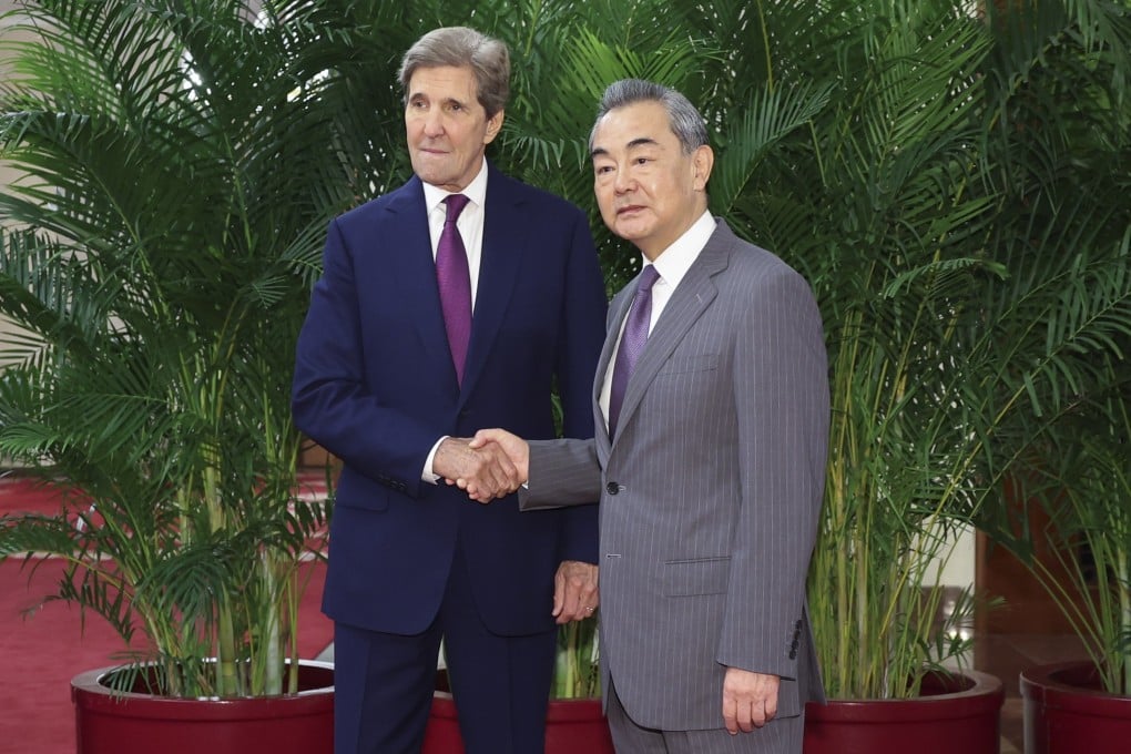 US climate envoy John Kerry visited China in July, meeting officials including Wang Yi. Photo: EPA-EFE