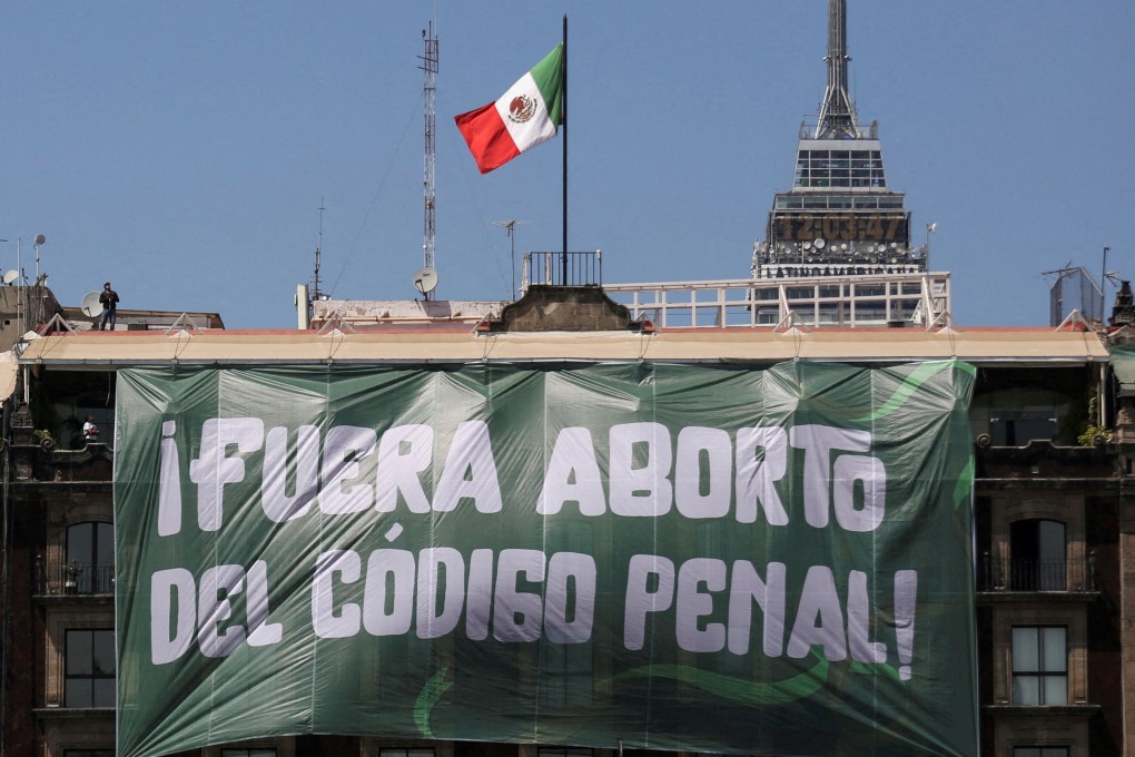 A banner reading: “Abortion Out of the Penal Code” hangs from a building during International Women’s Day in Mexico City, on March 8. Photo: Reuters