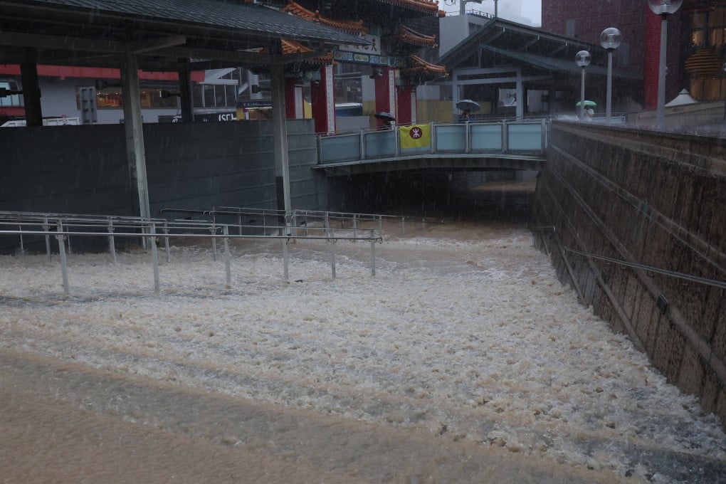 Rainwater flows into the Wong Tai Sin Shopping Centre. Between 11pm on Thursday and midnight, 158.1mm of rain was recorded at the Observatory headquarters, the most in an hour since records began in 1884. Photo: Edmond So
