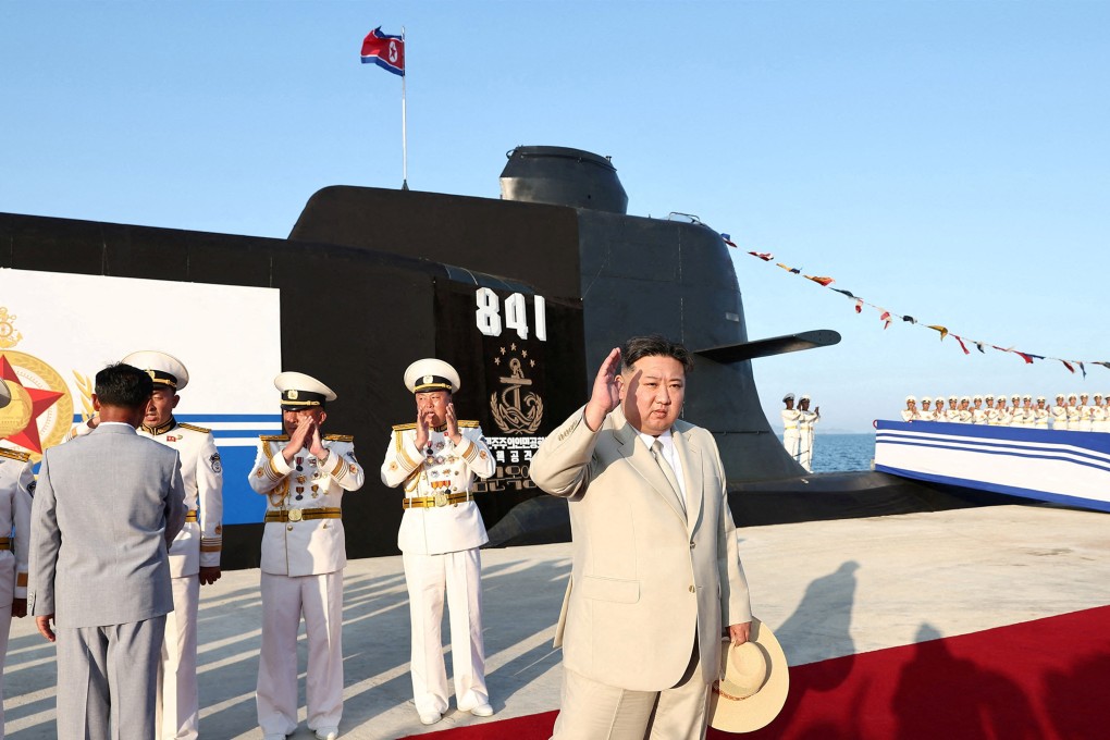 North Korean leader Kim Jong-un attends the launching ceremony for what state media reported was a new tactical nuclear attack submarine. Photo: KCNA via Reuters