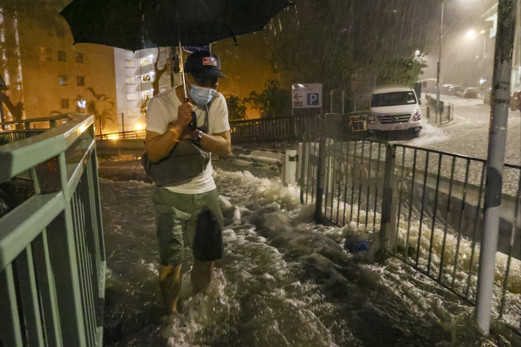 A man wades through floodwater in Chai Wan on August 8. Photo: Dickson Lee