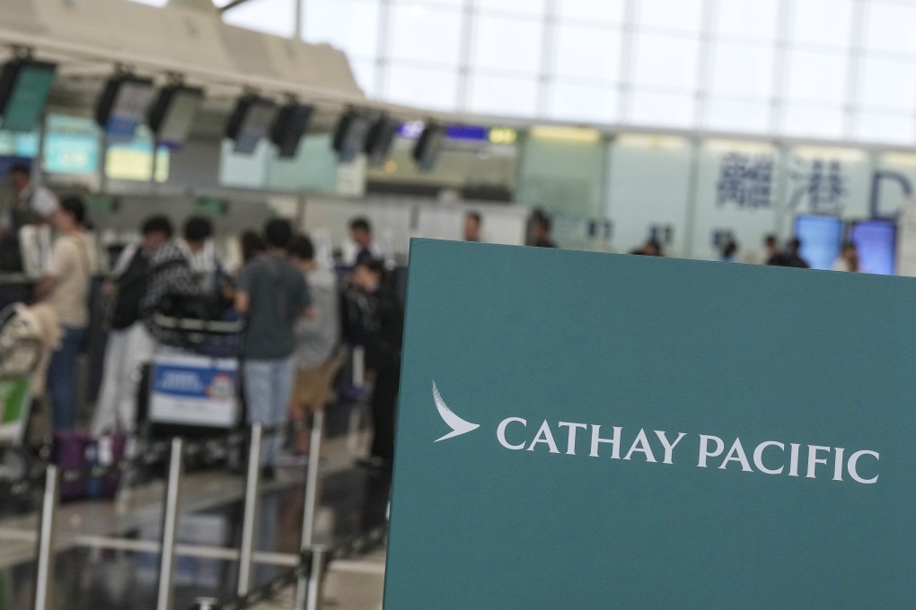 Passengers check in at Cathay Pacific counters at Hong Kong airport on August 9. Photo: Elson Li