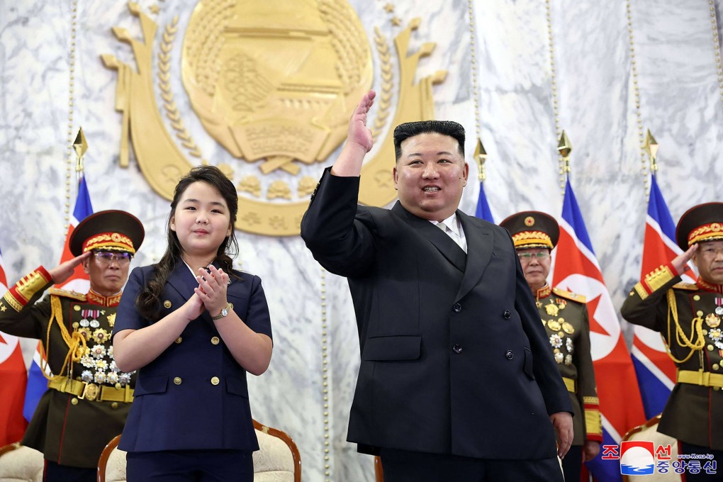 North Korean leader Kim Jong-un and his daughter (left) attending the paramilitary parade at Kim Il Sung Square in Pyongyang on Friday. Photo: KCNA via KNS/AFP