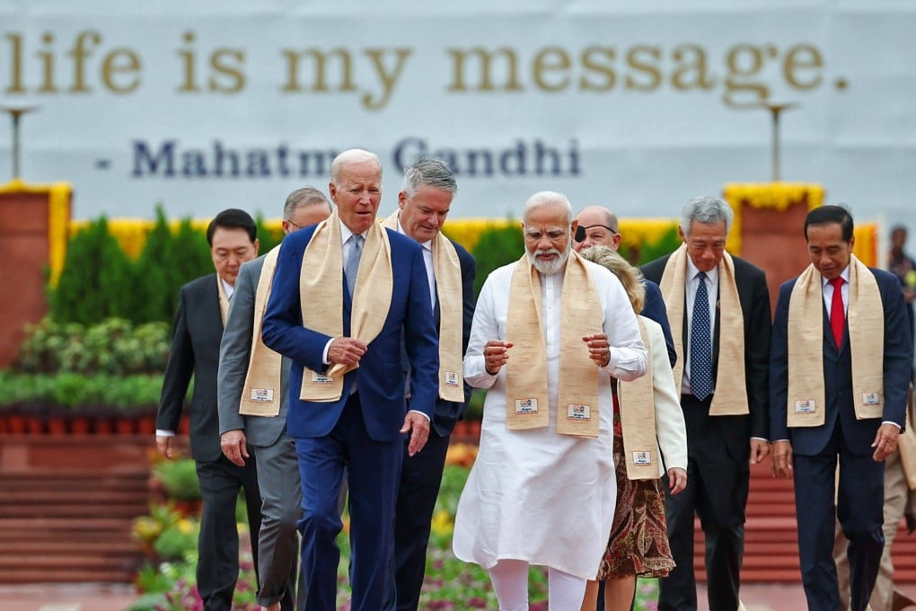 India’s Prime Minister Narendra Modi (C), US President Joe Biden and other world leaders arrive to pay their respects at the Mahatma Gandhi memorial on the sidelines of the G20 summit in New Delhi on Sunday. Photo: AFP