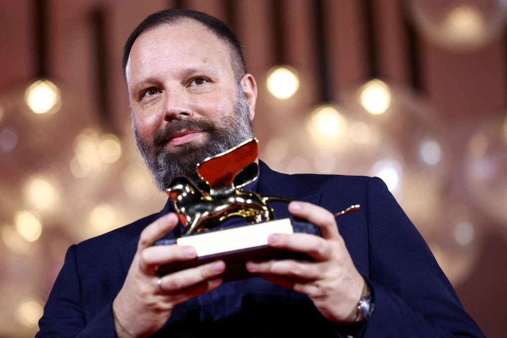 Director Yorgos Lanthimos poses with the Golden Lion Award for Best Film for his movie “Poor Things” at the closing ceremony of the 2023 Venice International Film Festival. Photo: Reuters