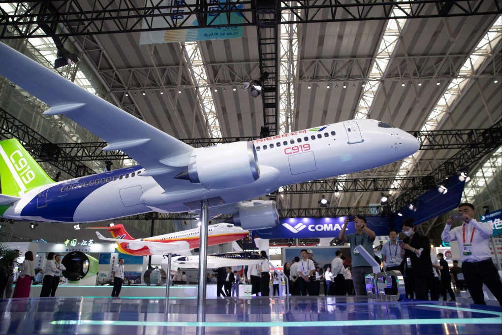 People view a model of China’s C919 passenger jet at the 6th China International Advanced Materials Industry Expo in Heilongjiang province last month. Photo: Xinhua