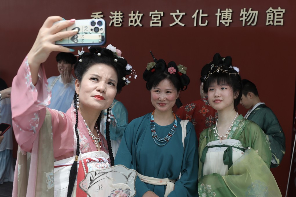 A group of Chinese nationalists clad in traditional ‘Huafu’ costume celebrate the July 1st Hong Kong Handover anniversary outside in the Palace Museum in West Kowloon. Rising nationalism in China has spurred increasing interest in Han clothing styles amid rising intolerance for some other types of dress. Photo: SCMP / Xiaomei Chen