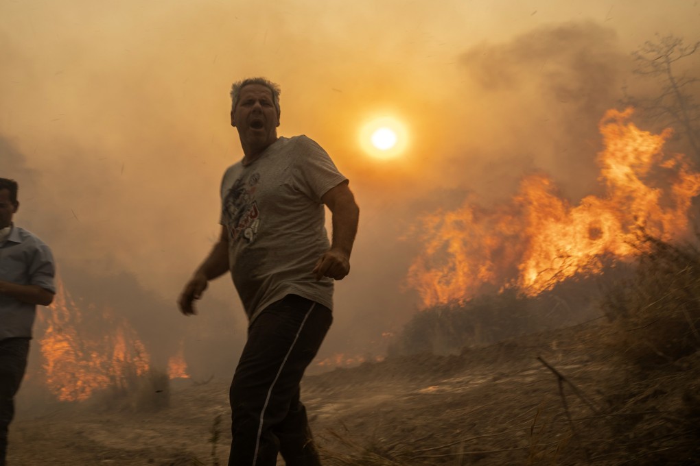 Wildfires rage in Gennadi village, on the island of Rhodes, Greece, on July 25, 2023. The Greek government is now working with the tourism sector to rescue the season after the natural disaster. Photo: AP