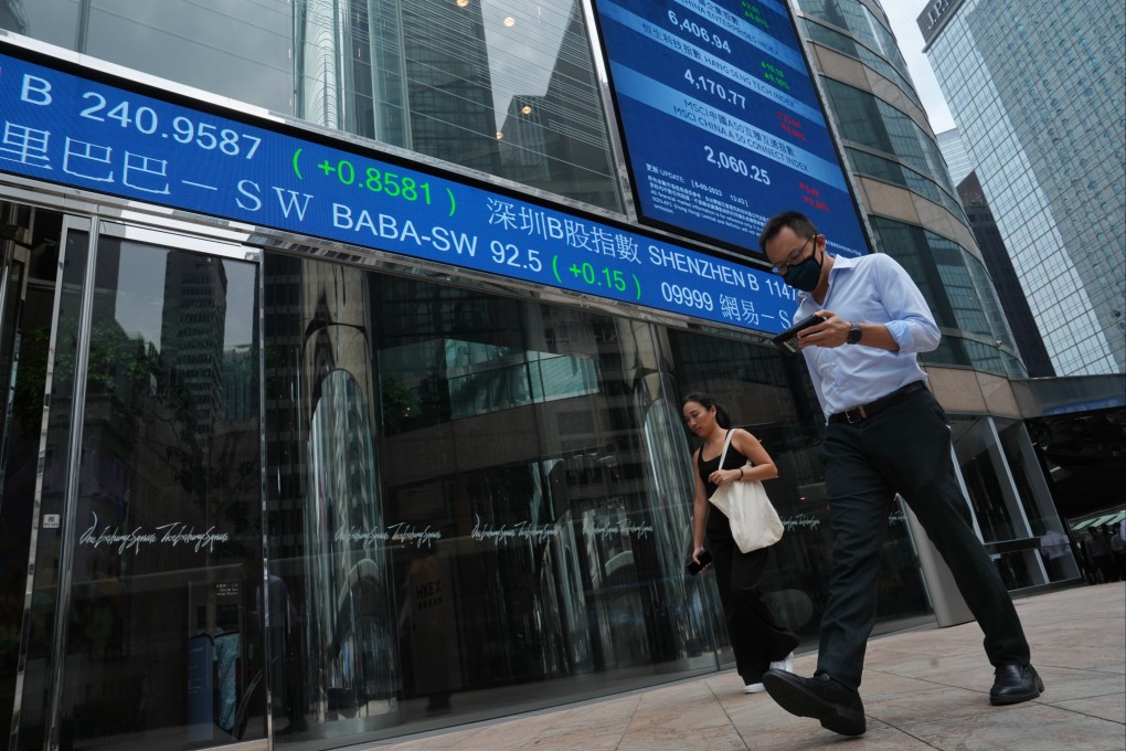 People walk through the piazza in front of the headquarters of Hong Kong Exchanges and Clearing Limited (HKEX), Central. Photo: Elson LI