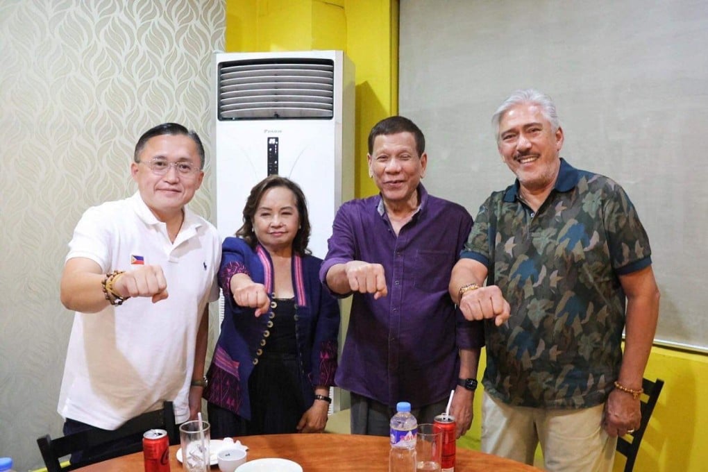 Former Philippine president Gloria Macapagal Arroyo (second from left) with Rodrigo Duterte during their meeting in Manila. Photo: Facebook/senatorbonggo