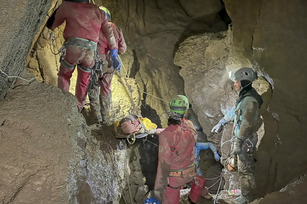 Members of the CNSAS, Italian alpine and speleological rescuers, carry a stretcher with American researcher Mark Dickey during a rescue operation in the Morca cave near Anamur, southern Turkey on Monday. Photo: CNSAS via AP