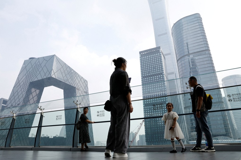 People stand at a shopping mall near the CCTV headquarters and China Zun skyscraper in Beijing’s central business district on September 7, 2023. Beijing-based BlueRun Ventures China is the second major venture capital firm to drop the brand of its US namesake amid geopolitical tensions between the two countries. Photo: Reuters