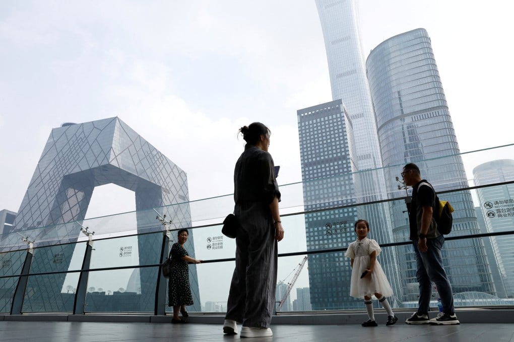 People stand at a shopping mall near the CCTV headquarters and China Zun skyscraper in Beijing’s central business district on September 7, 2023. Beijing-based BlueRun Ventures China is the second major venture capital firm to drop the brand of its US namesake amid geopolitical tensions between the two countries. Photo: Reuters
