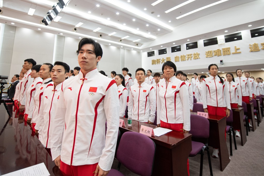 Members of Chinese delegation for the Hangzhou Asian Games sing the national anthem during the inaugural meeting of the delegation in Beijing. Photo: Xinhua