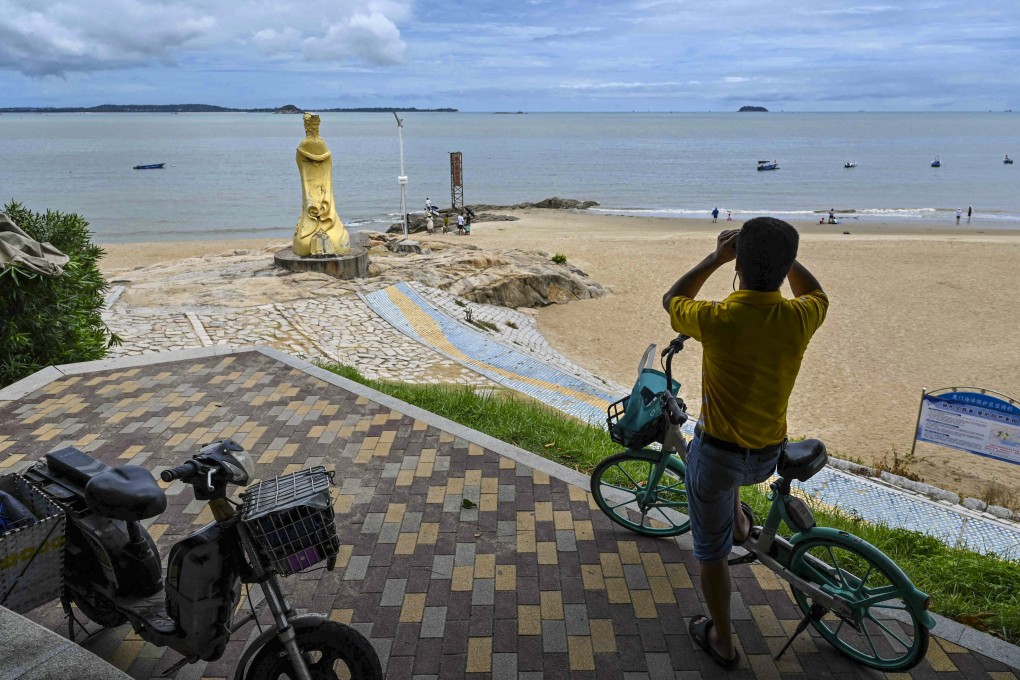 A man in Xiamen on the Chinese mainland looks across the Taiwan Strait towards Quemoy, also called Kinmen. Photo: AFP