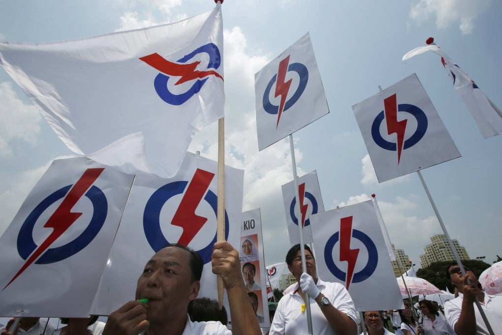 Supporters of Singapore’s People’s Action Party cheer for their candidates ahead of the 2015 general election. Photo: Reuters
