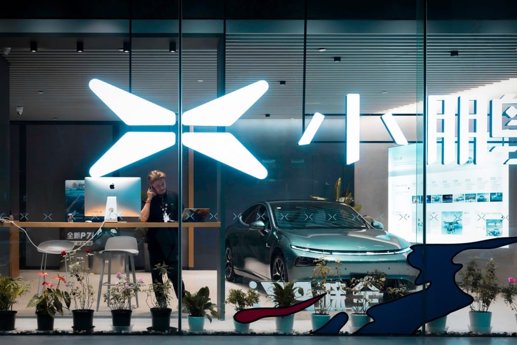 A man talks on the phone in a shop of Chinese electric vehicle manufacturer Xpeng, in Shanghai, China, 15 September 2023. The European Commission on 13 September had launched an investigation aimed at assessing the feasibility of imposing punitive tariffs on Chinese electric vehicle (EV) imports. The purpose of the measure is to protect European Union producers from the influx of less expensive EVs from China that allegedly receive state subsidies. The Commission is currently deliberating the option of imposing tariffs that exceed the standard rate of 10 percent, which could take up to 13 months to evaluate. Photo: EPA-EFE