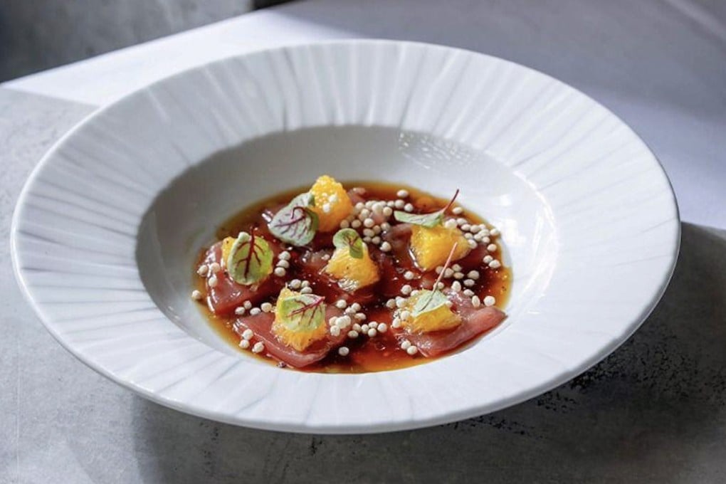 Tuna with crispy bulgur wheat, orange, ponzu and aromatic leaves at Pastel. The restaurant, at the Tel Aviv Museum of Art, in Israel, is one of many around the world located in famous art galleries. Photo: Pastel