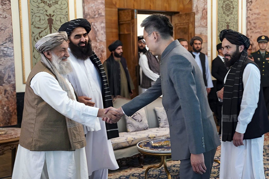China’s new ambassador to Afghanistan Zhao Sheng shakes hands with Taliban acting prime minister Mohammad Hasan Akhund, in Kabul on Wednesday. Photo: AP