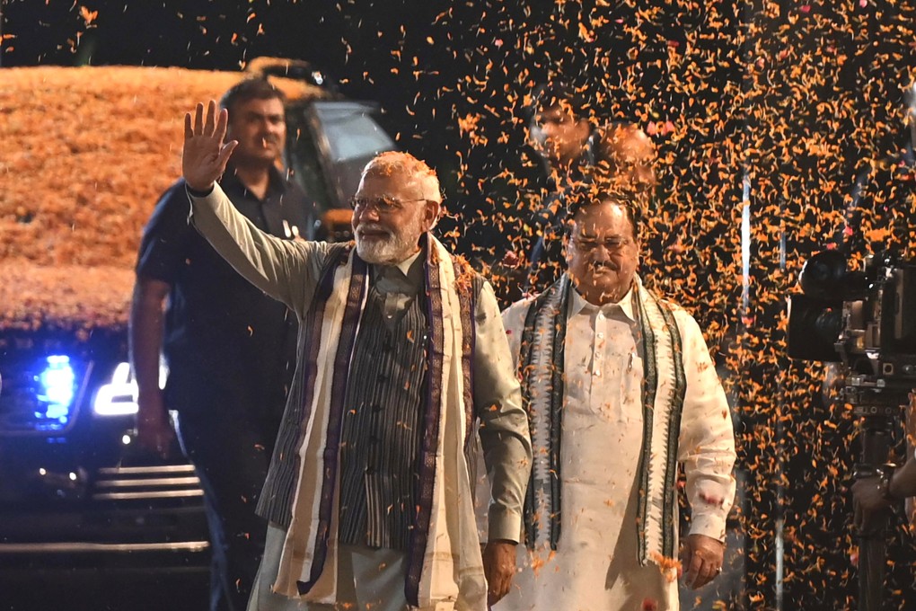 Supporters shower flower petals on Indian Prime Minister Narendra Modi on Wednesday after the country’s successful hosting of a G20 summit. Photo: AP