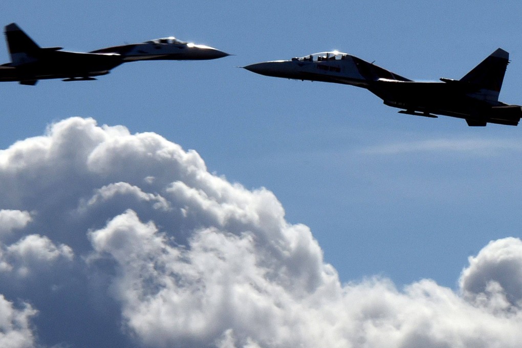 Russian Su-27 jet fighters perform during an air show in St Petersburg in April 2015. Photo: AFP