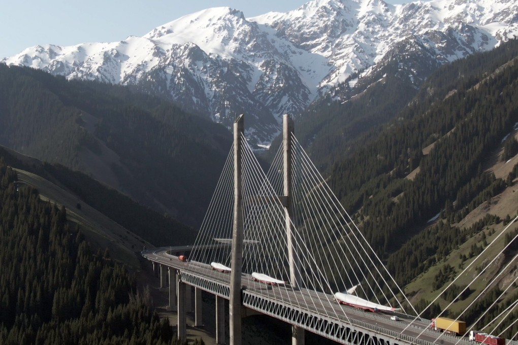 Vehicles carry components from Chinese green power developer Universal Energy across the Guozigou Bridge in Huocheng county, Xinjiang, bound for the 50 MW wind power project in Kostanay, Kazakhstan. China has increased its outreach towards Kazakhstan in recent years as the Central Asian country is seen as an important trade partner and link in the Belt and Road Initiative. Photo: Xinhua