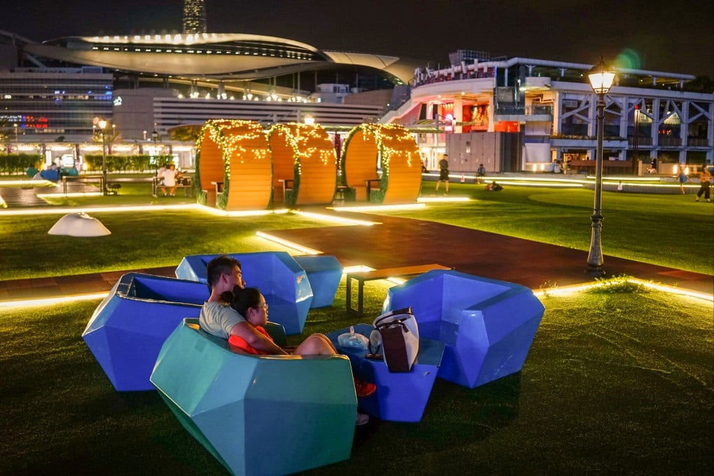 Hongkongers enjoy the Wan Chai waterfront at night. The government is trying to encourage more residents to come out in the evenings. Photo: Warton Li