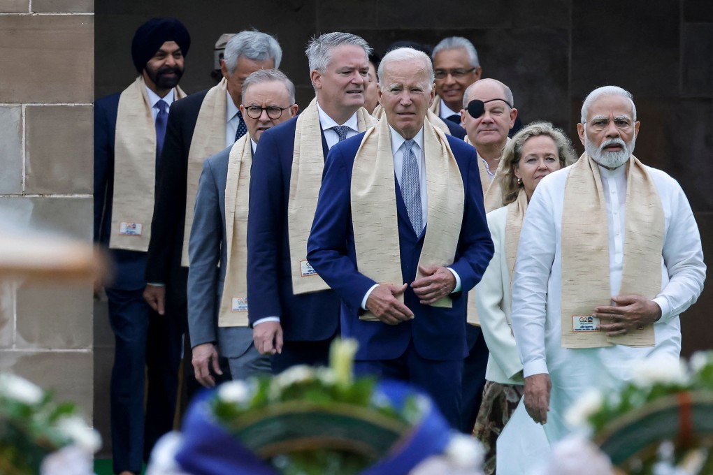 India’s Prime Minister Narendra Modi (right), US President Joe Biden (centre) and other world leaders arrive to pay respects at the Mahatma Gandhi memorial at Raj Ghat, on the sidelines of the G20 summit in New Delhi on September 10. Photo: Pool / AFP  /Getty Images / TNS