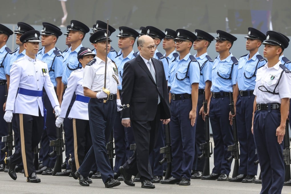 Zheng Yanxiong inspects officers at a passing-out parade for the first time in his role as liaison office director. Photo: Edmond So
